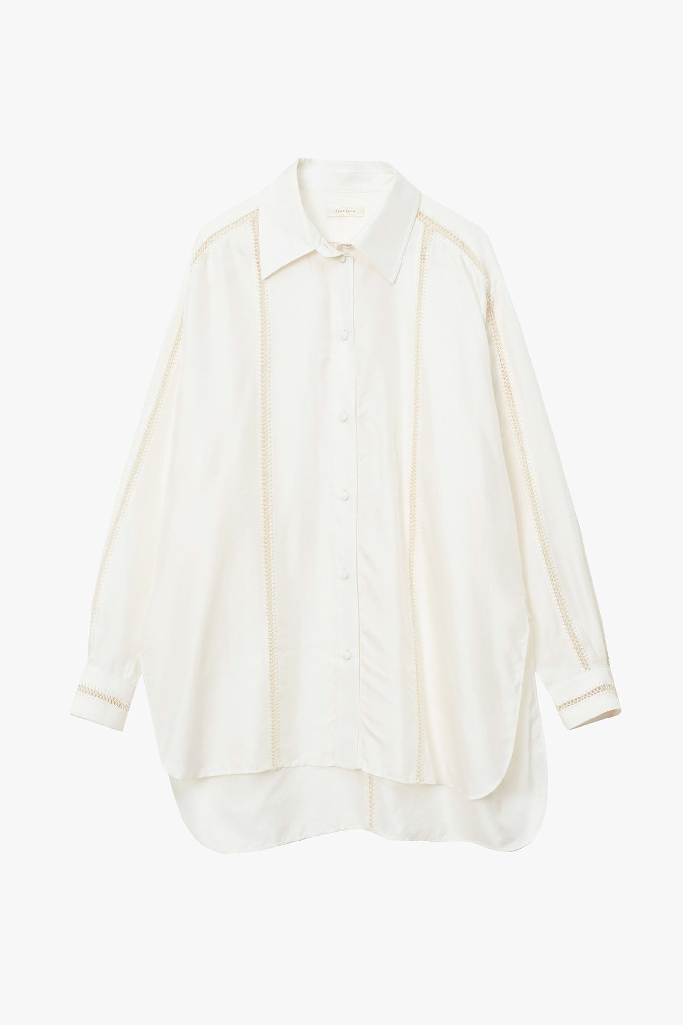 Off-white silk shirt with stripes of beige hand stitched detailing along sleeves, down the chest, and in a T along the back. Photographed on a white background.