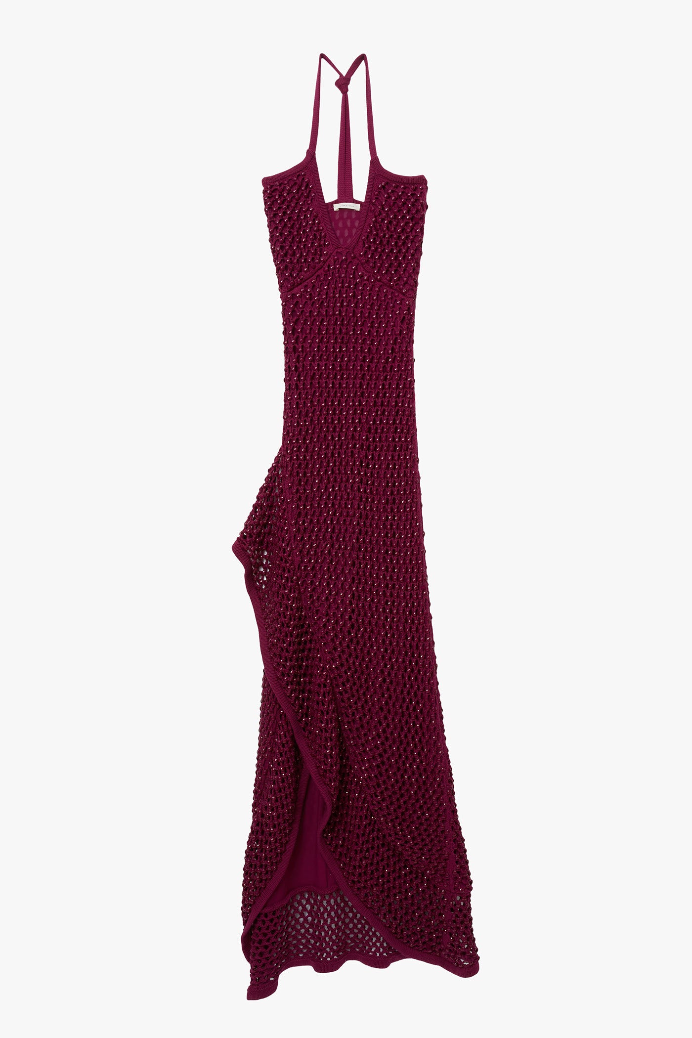 Magenta chunky crystal embellished camisole dress with open back on a white background. Dress has high slit and ruffle hem.
