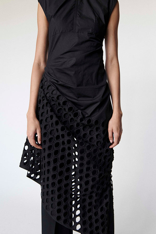 Black dress with a circular cut-out pattern on a white background