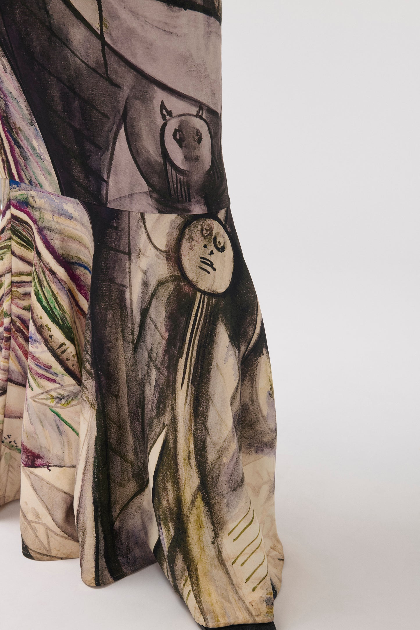 Close-up of a wide skirt featuring a painterly print.