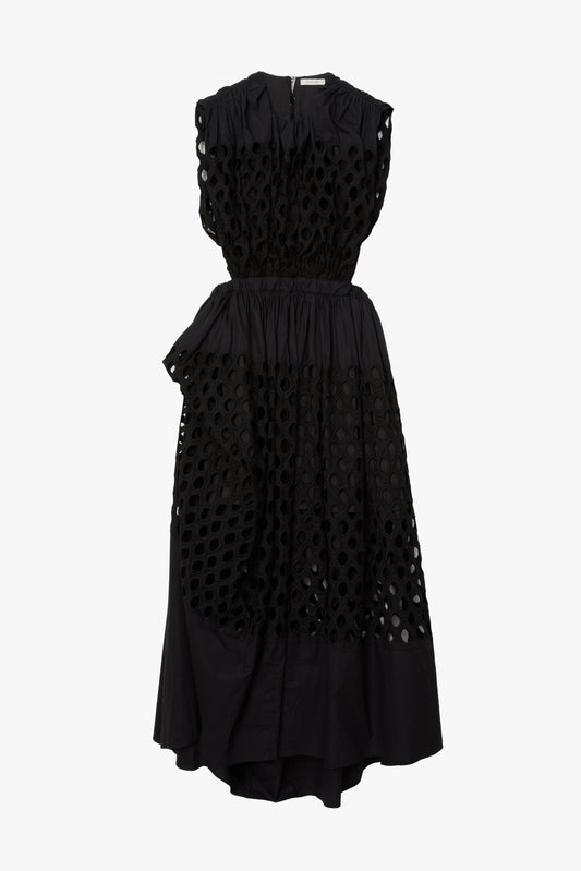 Black sleeveless ruched dress with cotton broderie anglaise mesh featuring a black cotton lining underneath. 