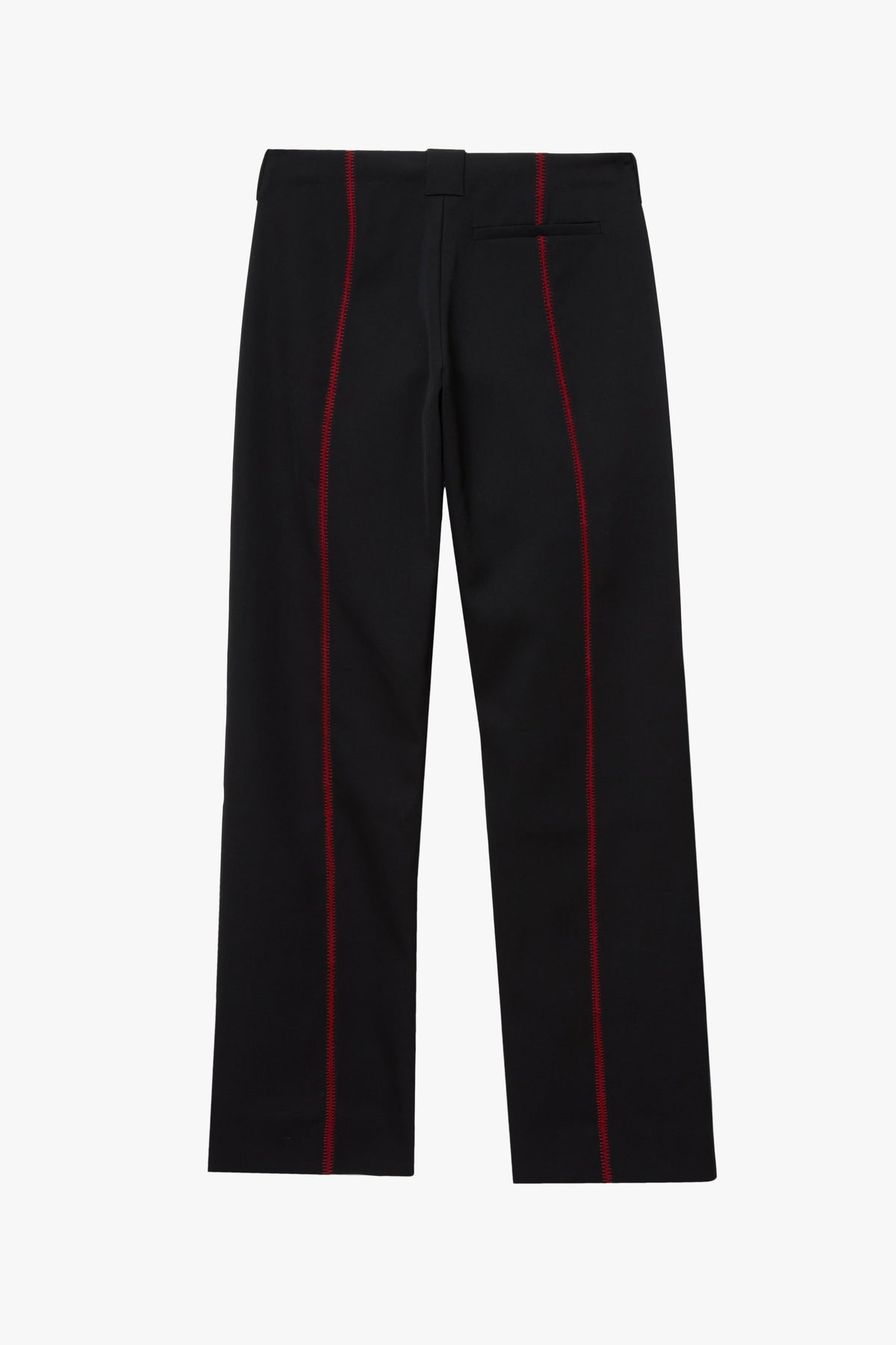 The back of a pair of trousers photographed against a plain white studio background. The black trousers have red stitching details on the side.