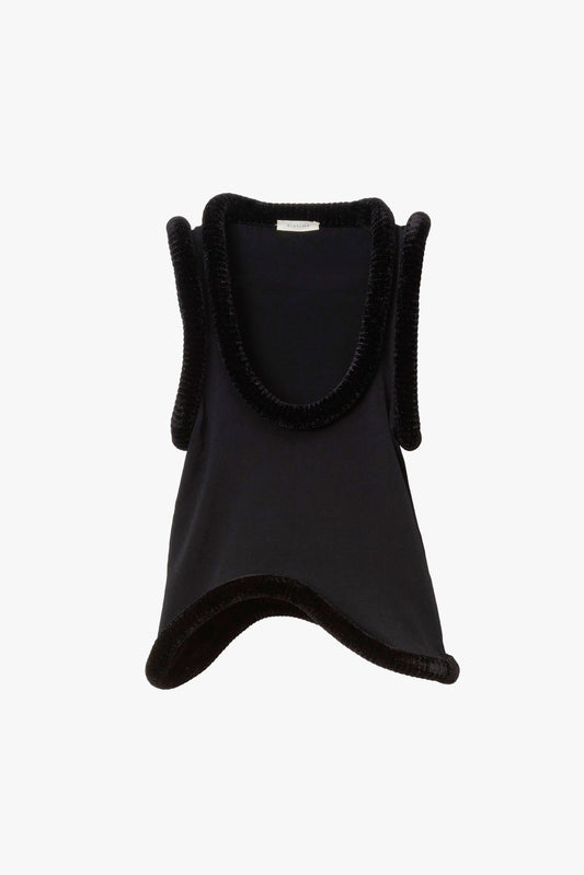 Black asymmetrical tank top with chenille sculptural piping around the neckline, sleeves and hem. 