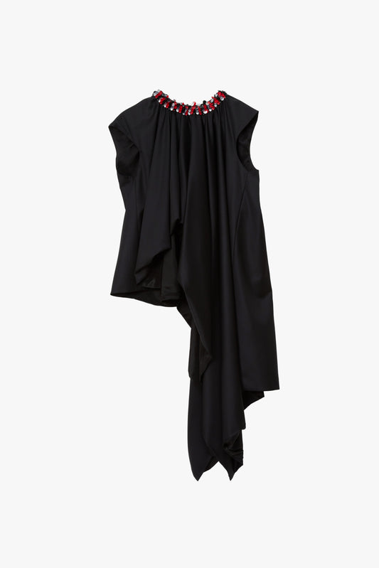 Asymmetrical black sleeveless top with extra draping on the wearer's front left side with red and silver paillettes along the neckline.