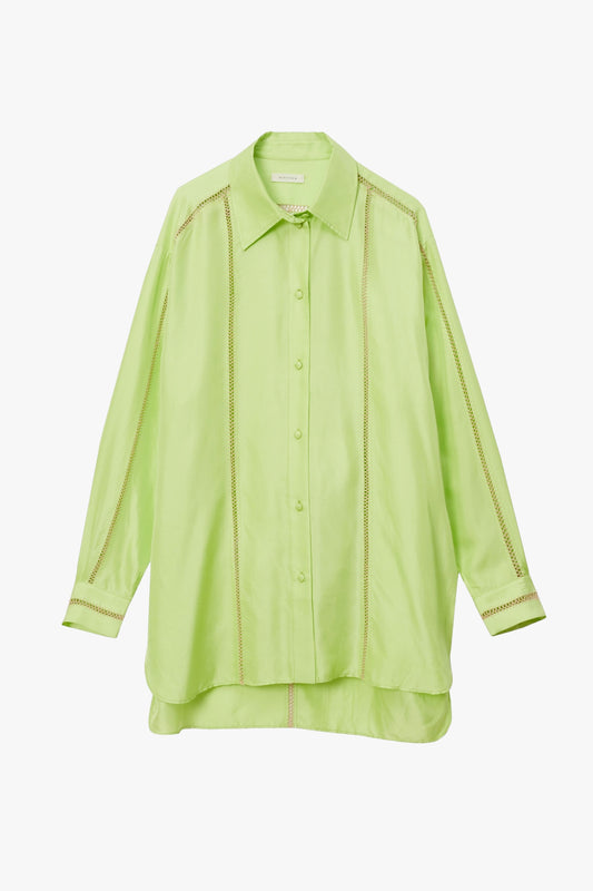 A light lime green long-sleeve button-up shirt with a pointed collar vertical stitched detailing and striped cuffs, shown against a plain white background.