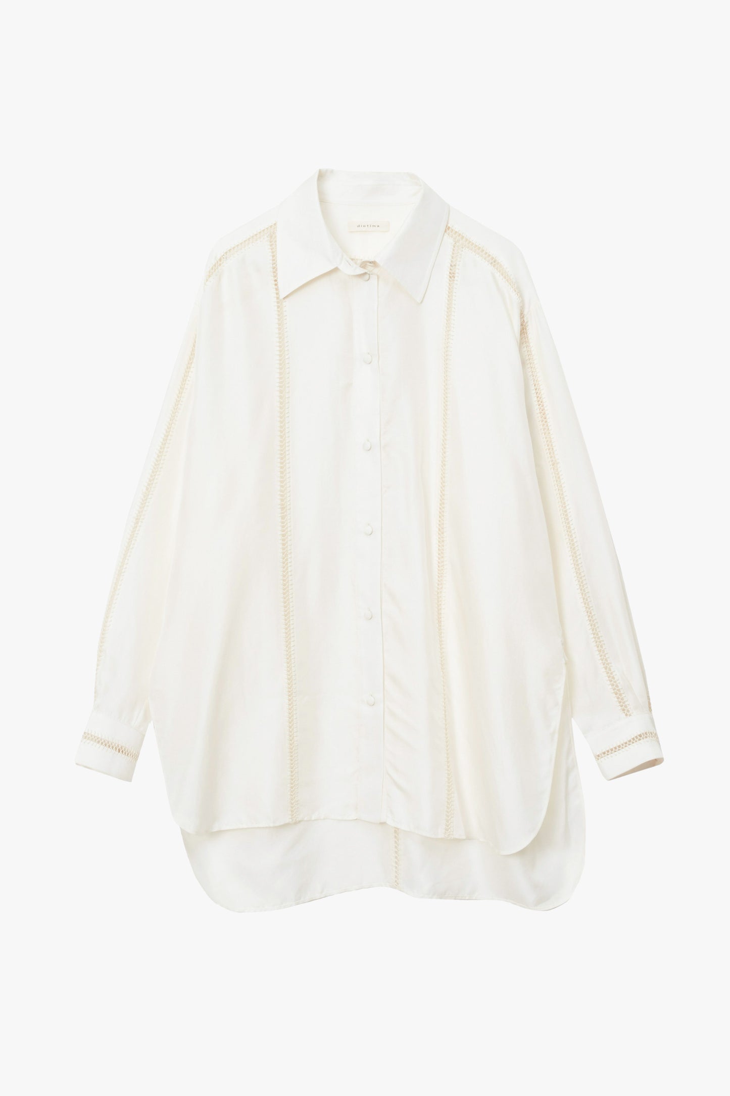 A long-sleeve button-up shirt in a warm off-white or cream color, featuring a pointed collar and vertical stitching details.
