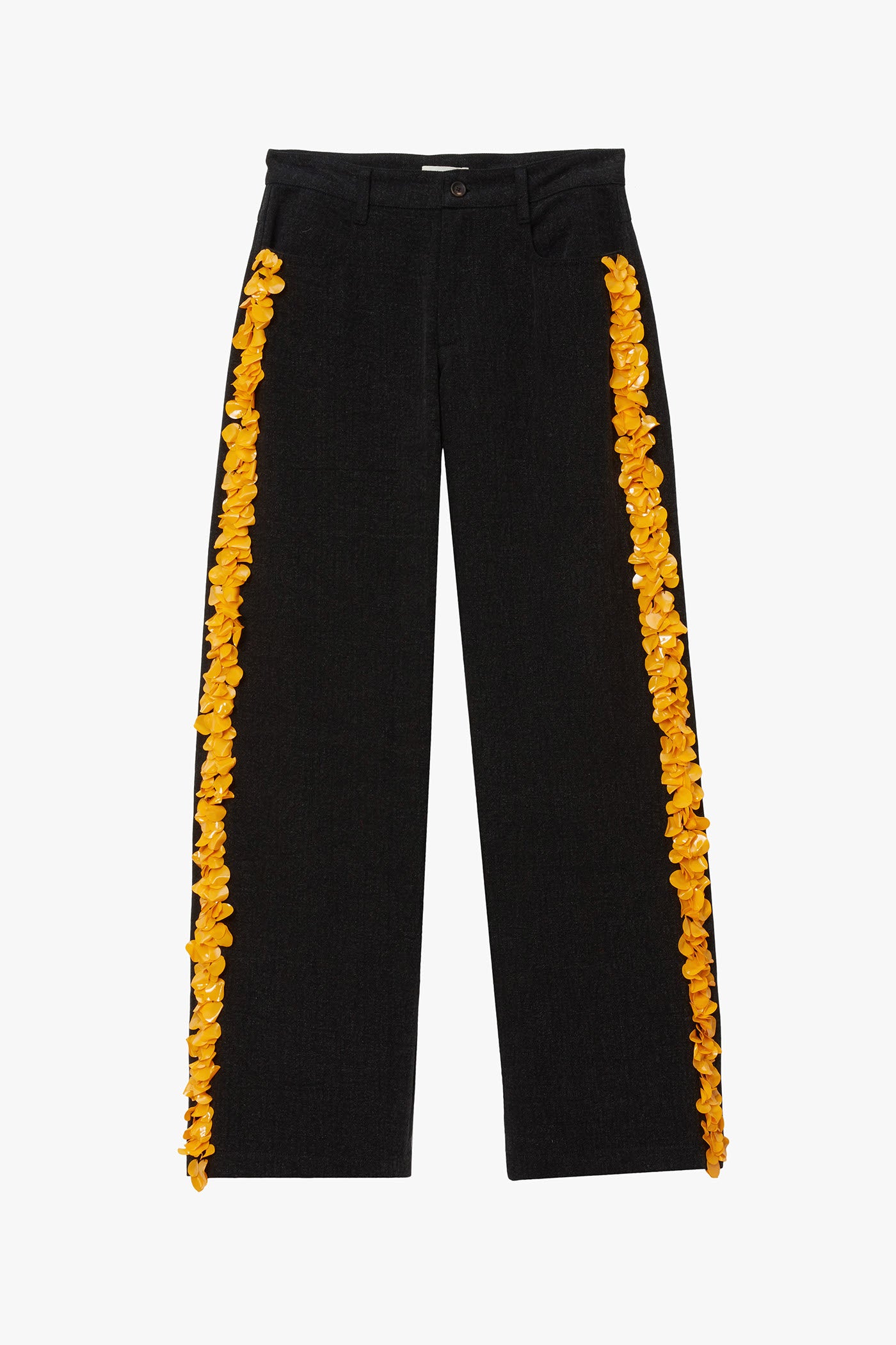 Black denim pants with yellow flat paillette embellishments along either leg photographed on a white background. 