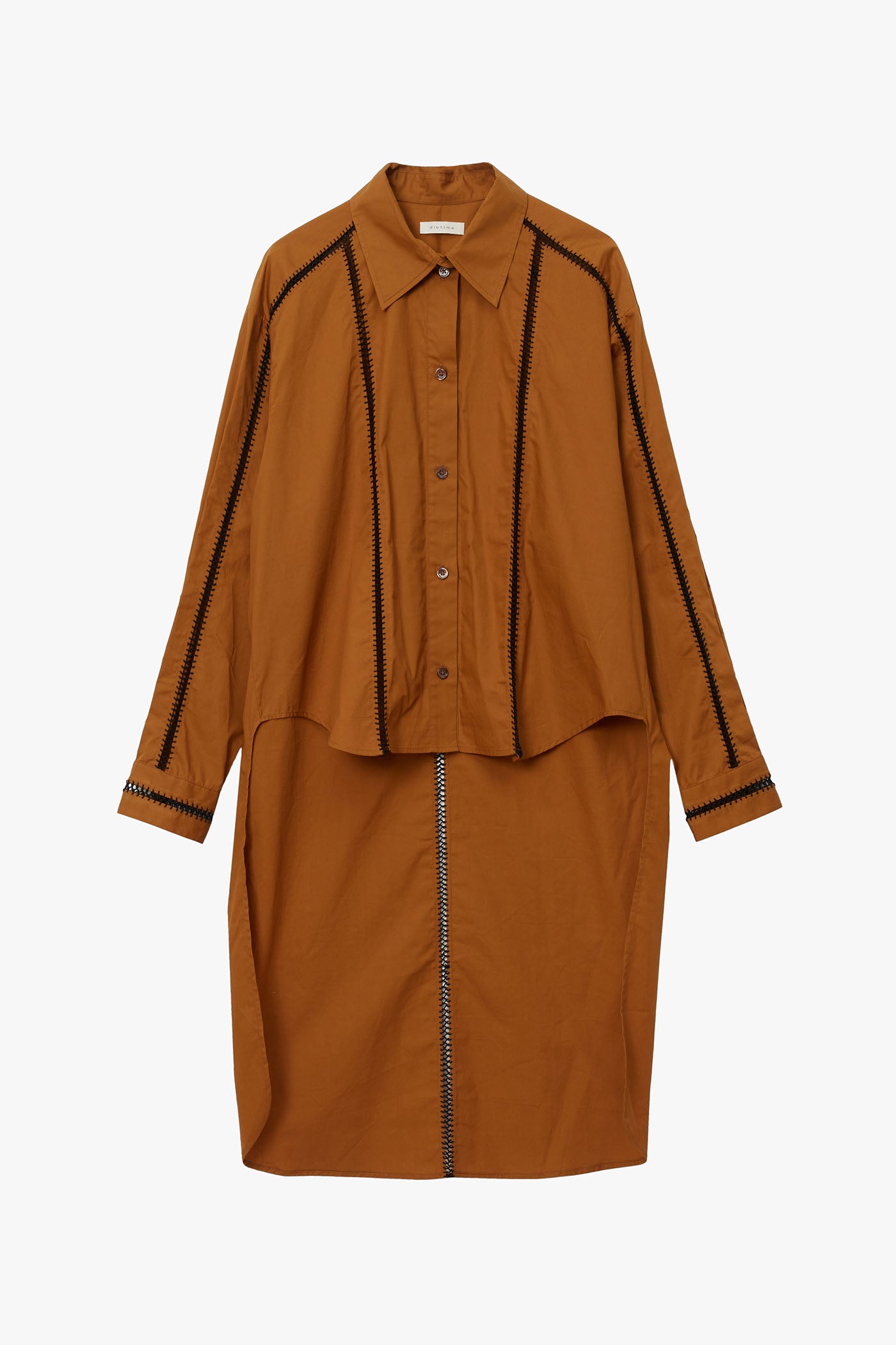 Cumin colored shirt with extended back panel and hand stitched detailing on front, back, and sleeves. Photographed on a white background.