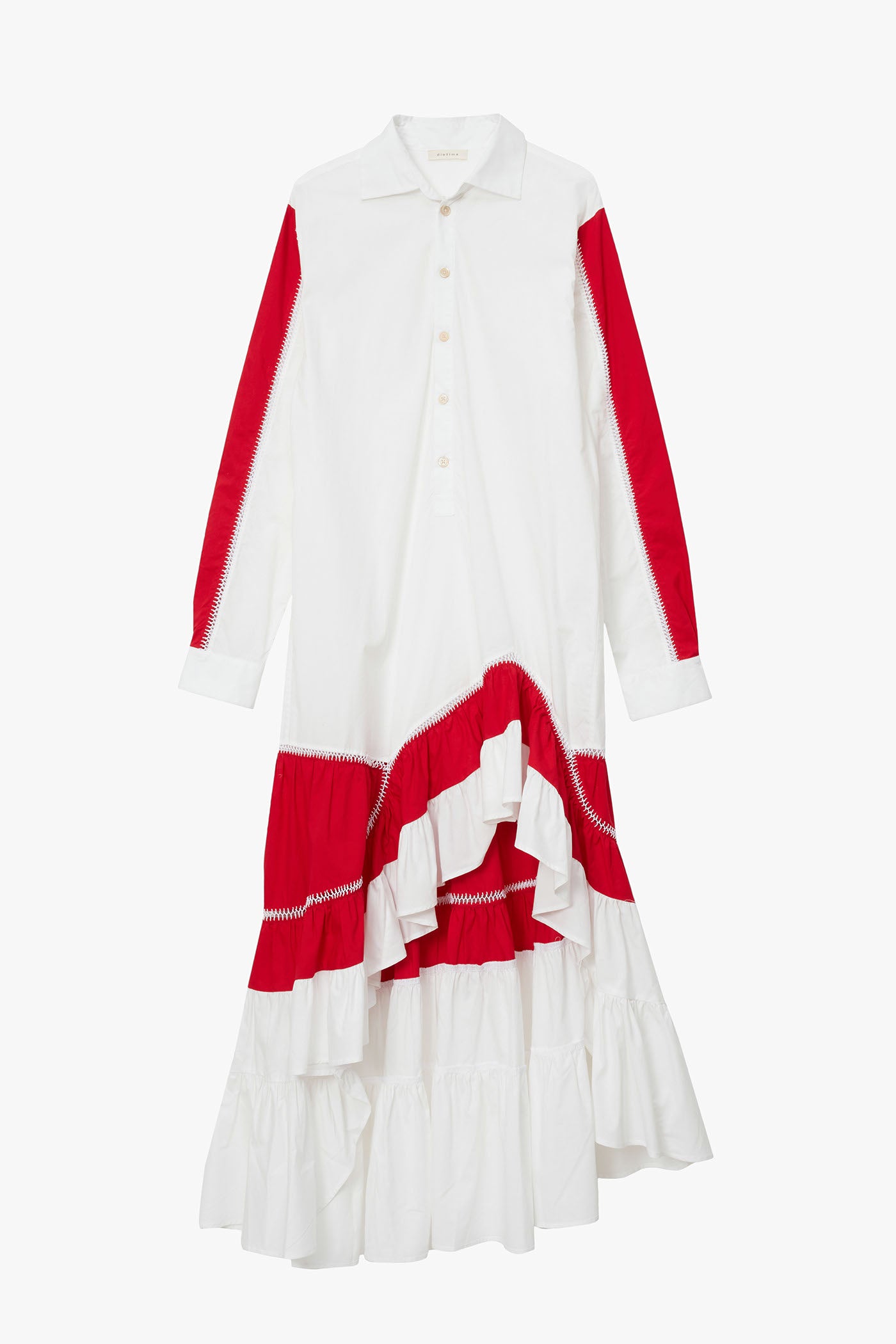 White shirt dress  with asymmetric red and white ruffle panels at hem and on sleeves. Photographed on a white background. 