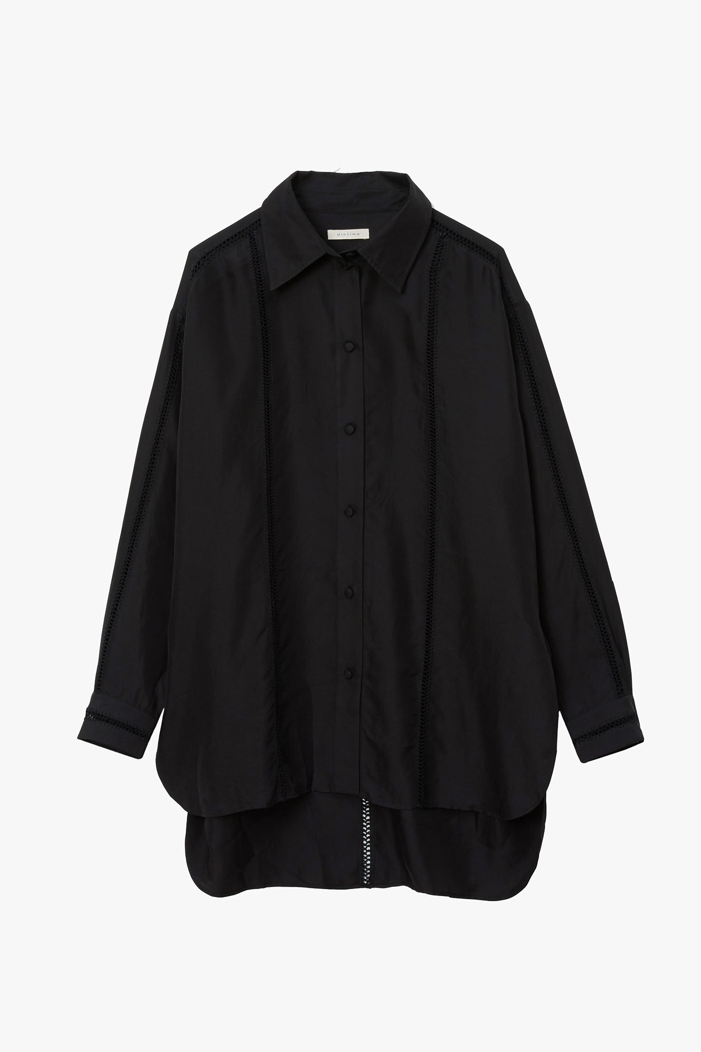 Black silk shirt with stripes of hand stitched detailing along sleeves, down the chest, and in a T along the back. Photographed on a white background.