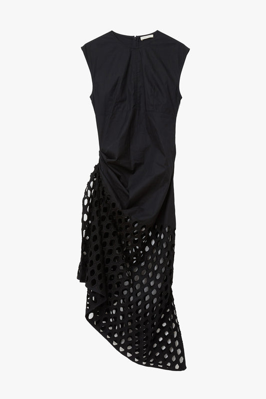 Black sleeveless dress with a drop waist with a unique cutout design photographed on a white background