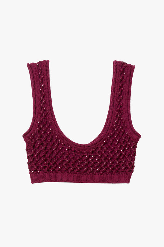 Magenta knitted chunky crystal embellished bralette on a white background. 