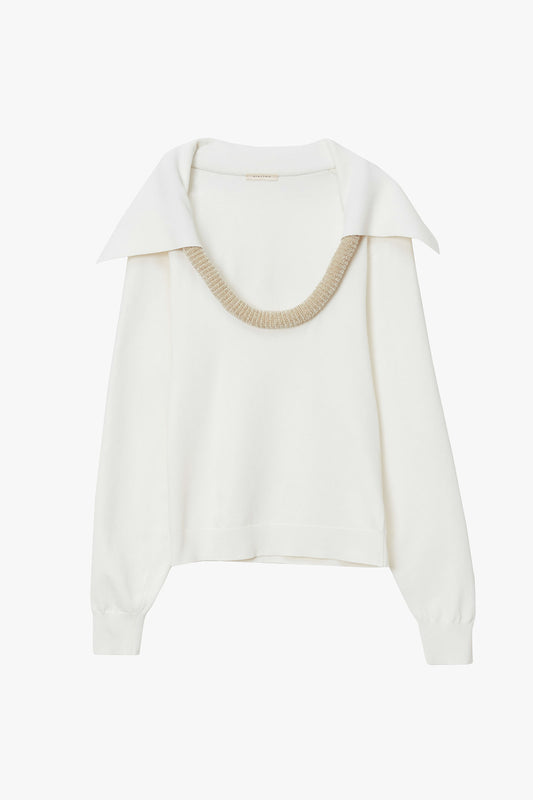White flat knit plunging neckline long sleeve sweater with biege sculptural tubing at neckline. Sweater has sailor collar extending from tubing at neckline. Photographed on a white background.