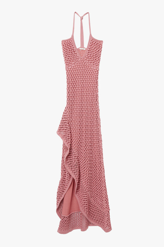 Pink chunky crystal embellished camisole dress with open back on a white background. Dress has high slit and ruffle hem. 