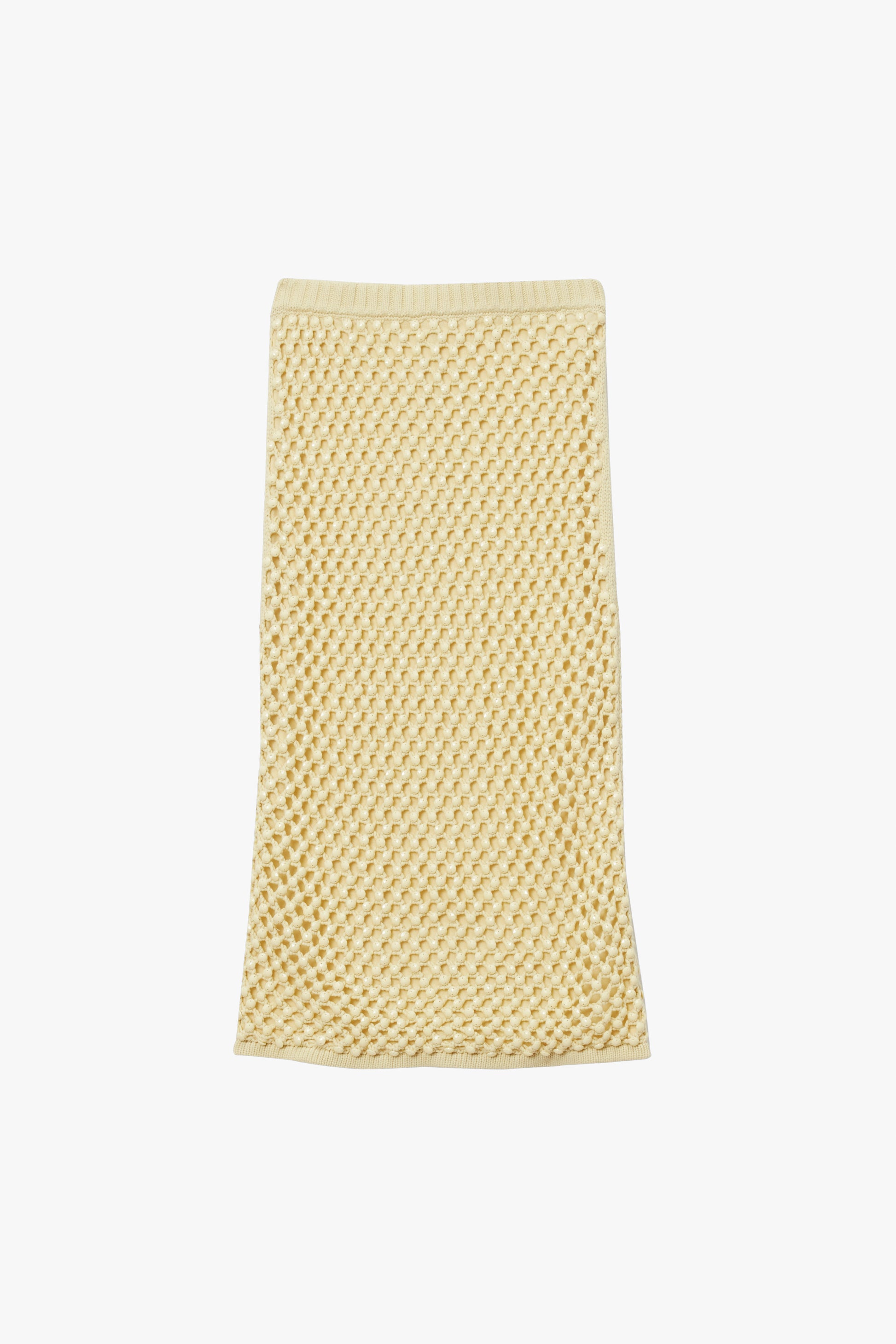 Yellow knit straight skirt with slip and crystal embroidery on a white background