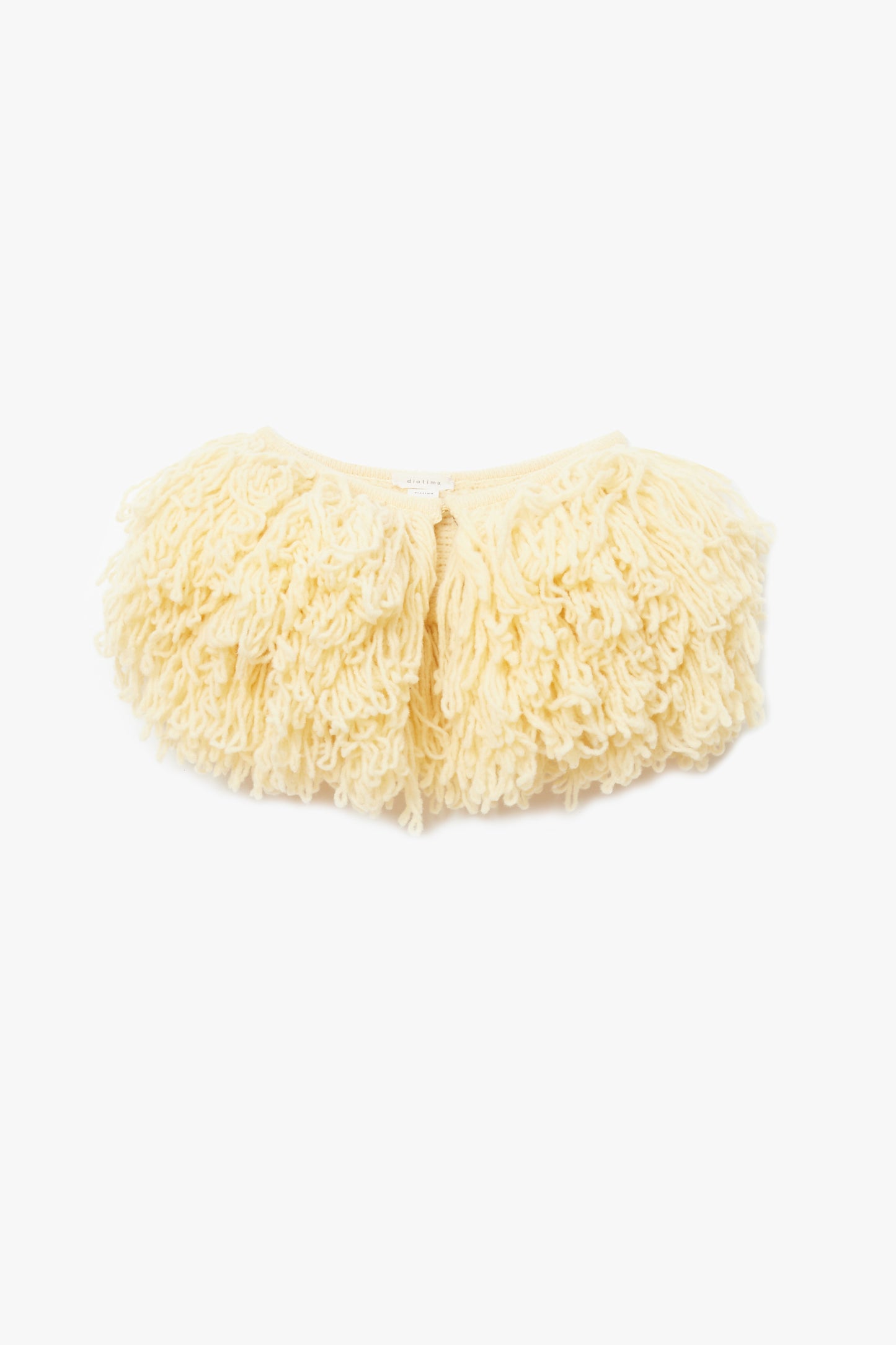 Yellow fluffy fringe collar photographed on a white background
