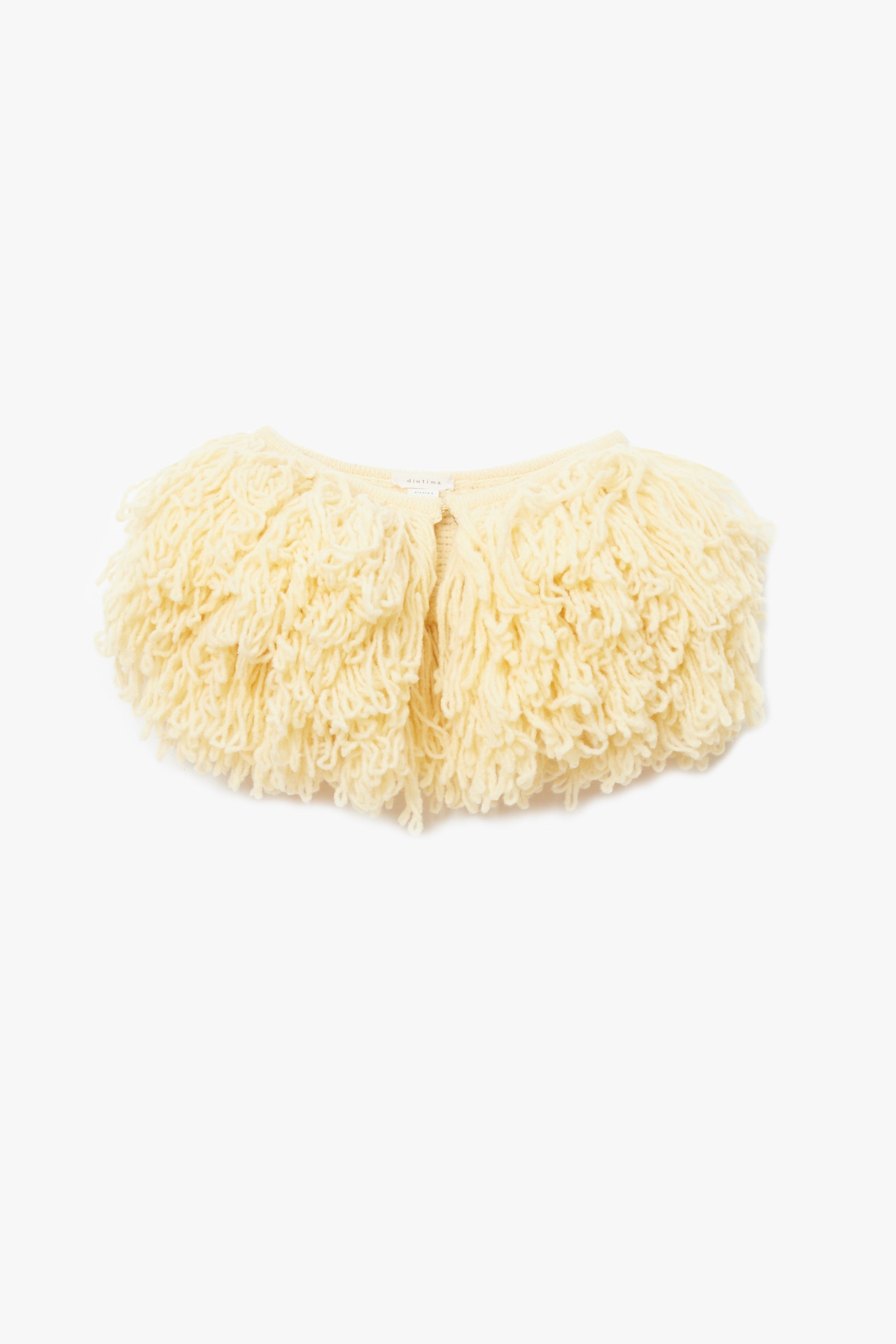 Yellow fluffy fringe collar photographed on a white background