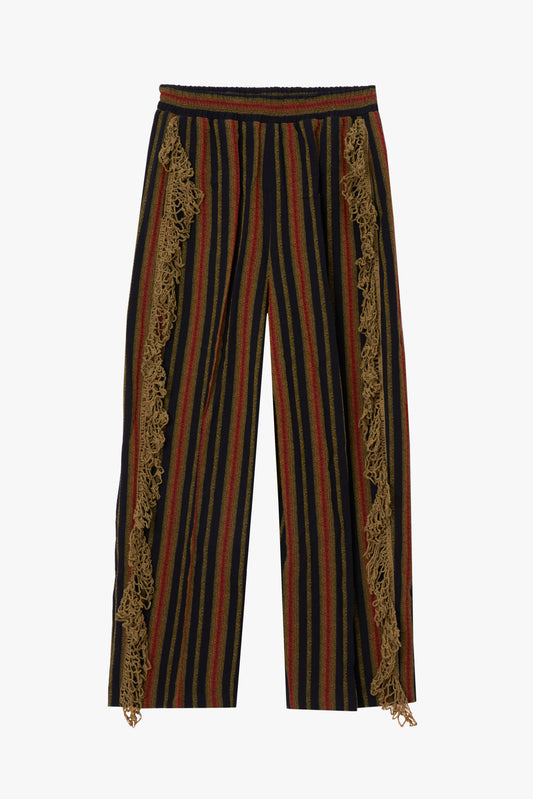 Striped pants with cumin-colored crochet trim on both legs on a white background