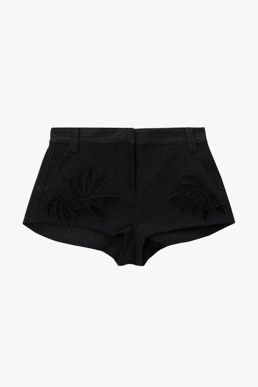 Black shorts with botanical cutouts on a white background