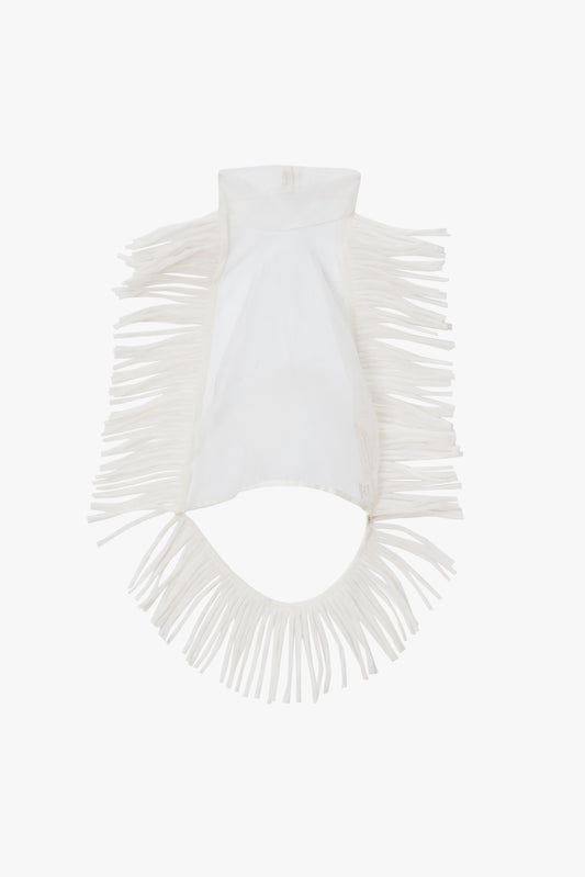 White sheer fringed top on a white background