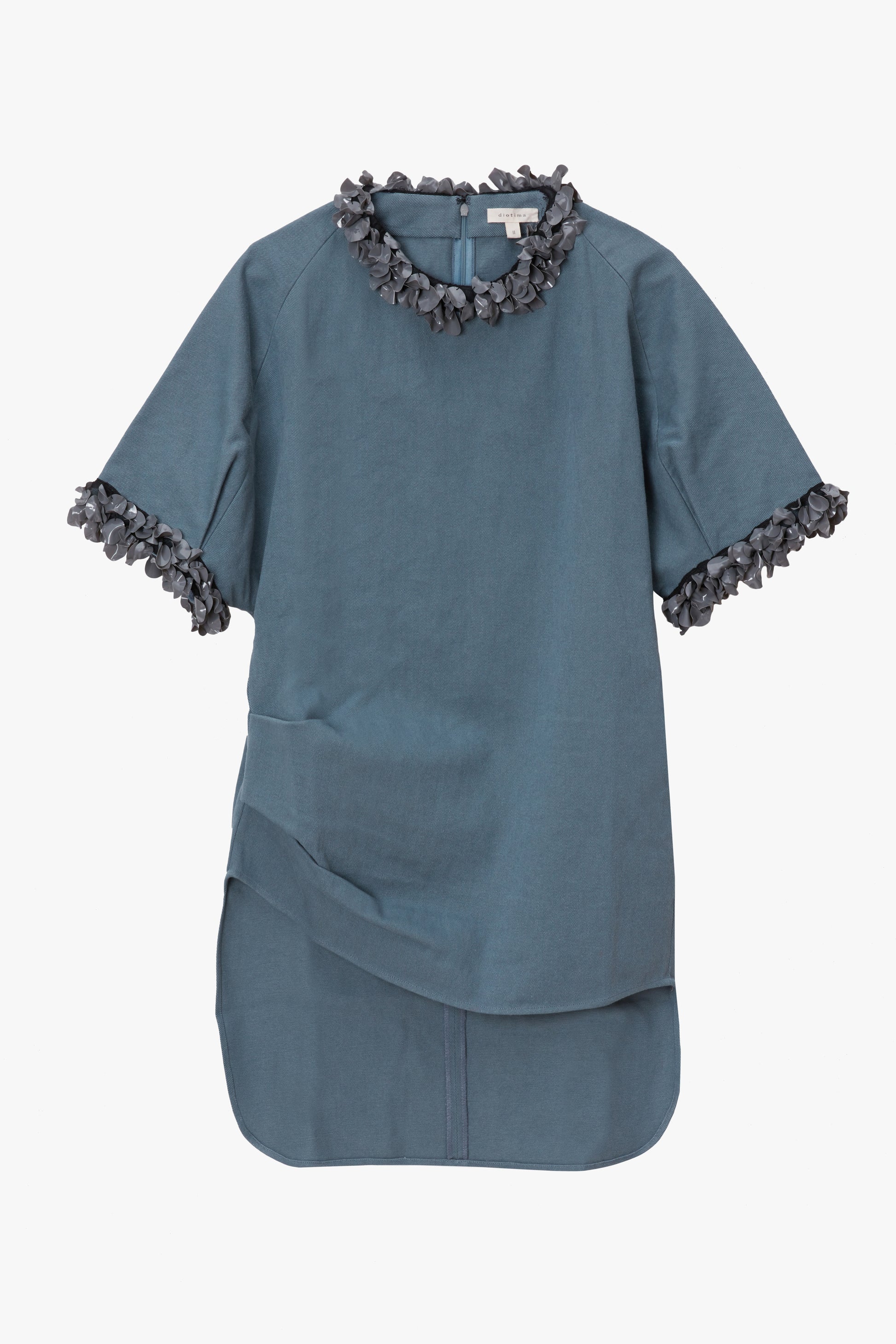 Blue shirt with paillette trim details on a white background