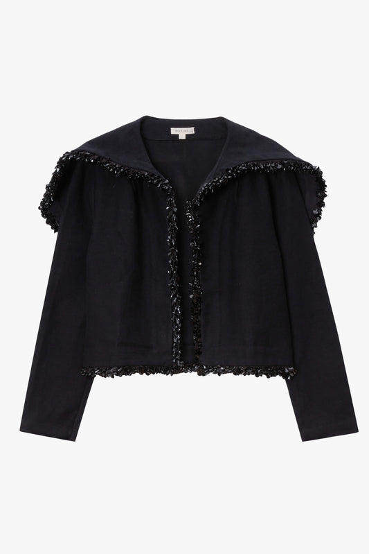 Black jacket with black paillette trim on a white background