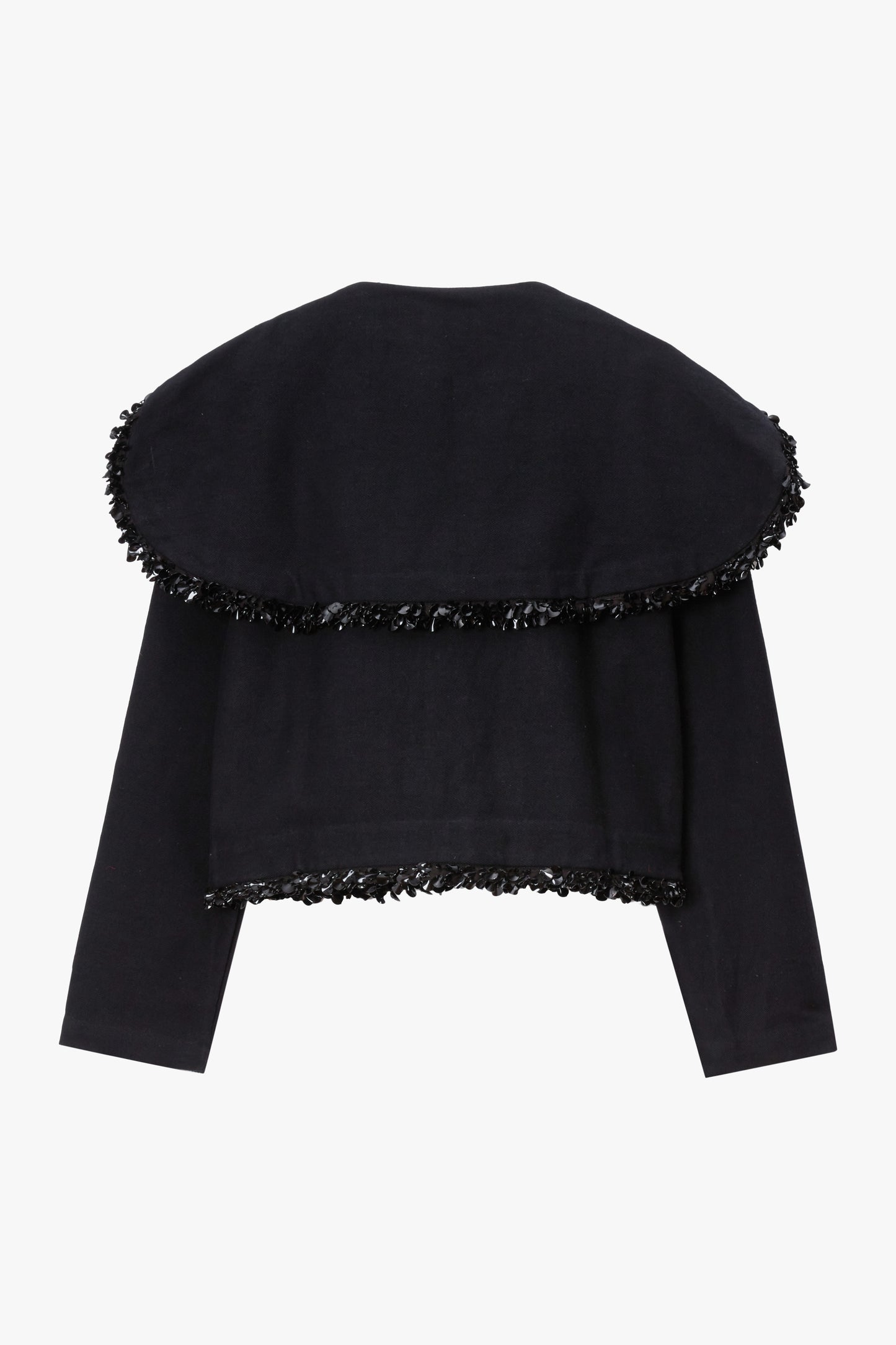 Black jacket with black paillette trim on a white background