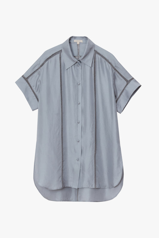 Light blue shirt with hand stitching on a white background
