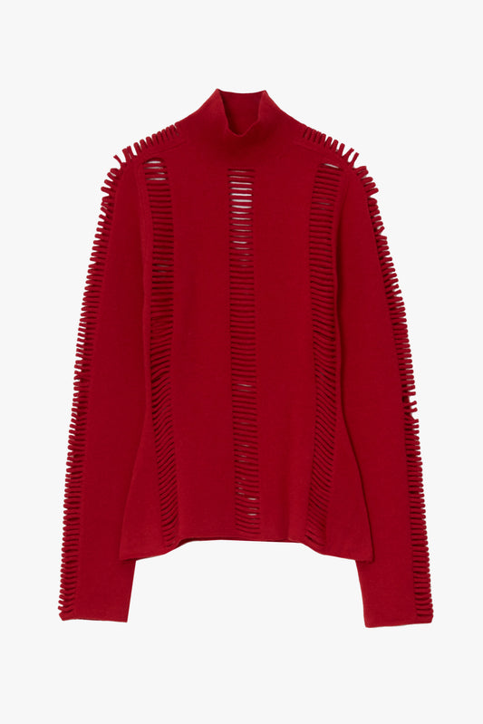 A red knit mock-neck sweater with vertical knit cutouts along the shoulders and sleeves
