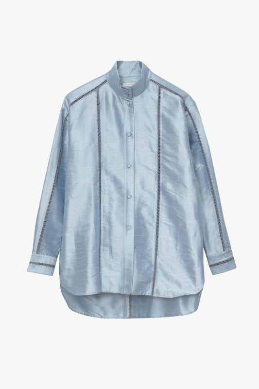 A light blue long-sleeve silk button-up shirt with a high collar, photographed flat against a white background.