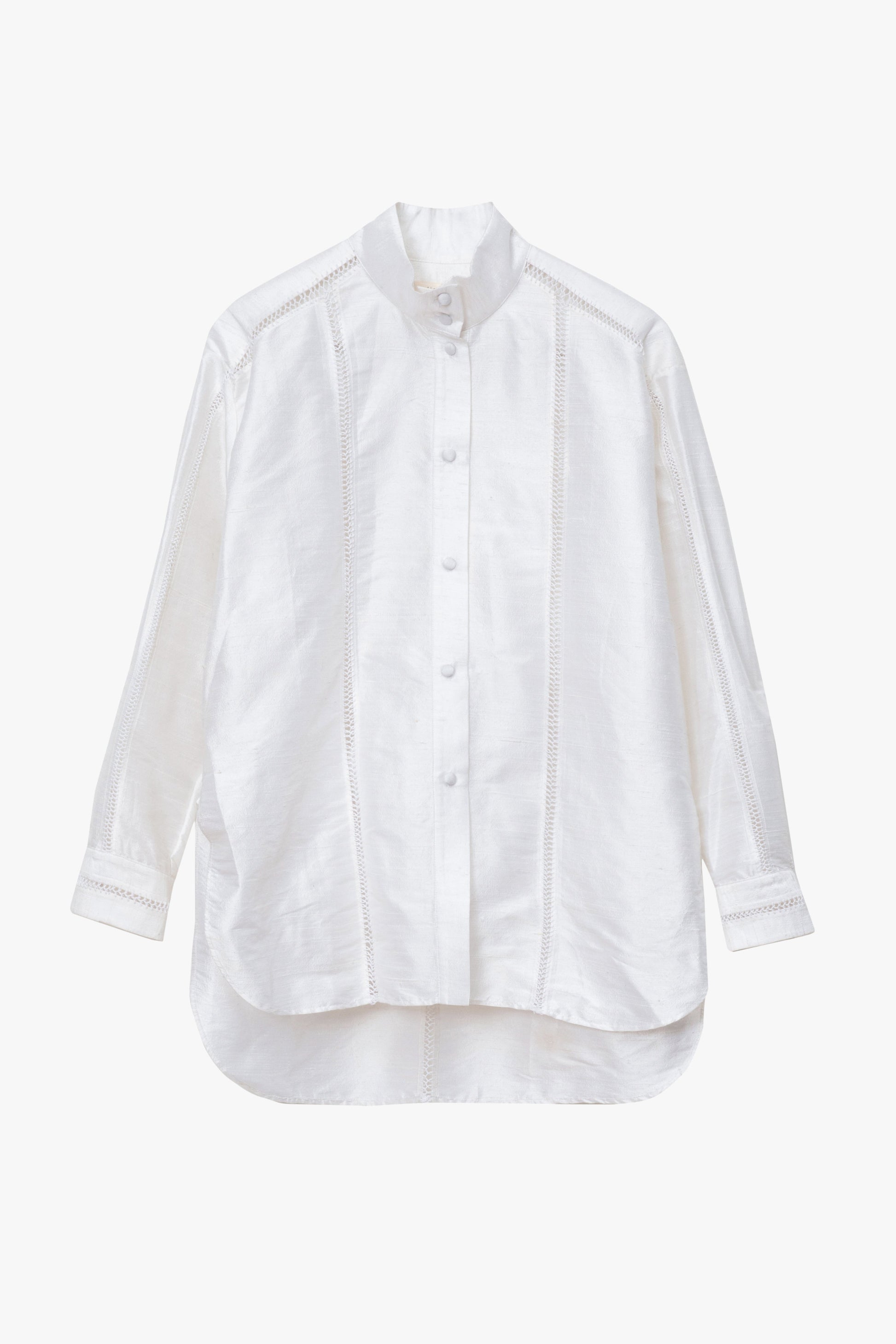 A white long-sleeve button-up shirt with a high-low hem and decorative handl-stitched embroidery, shown against a plain light gray background.