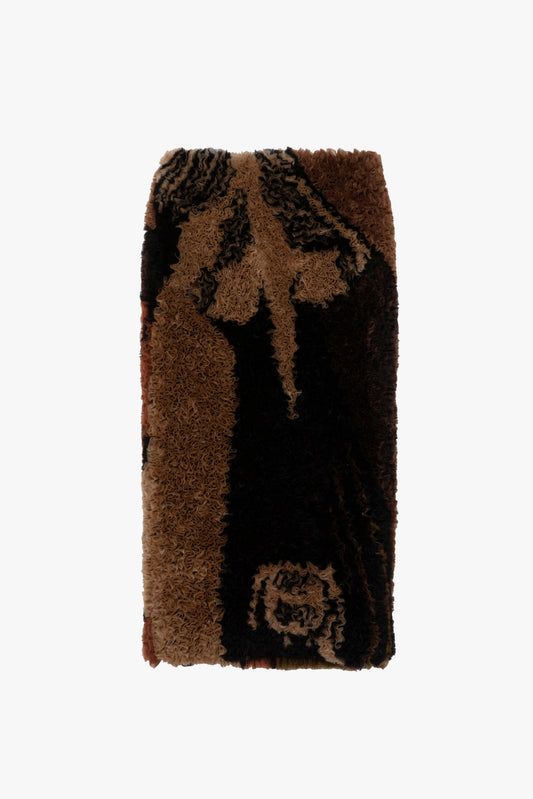 A ruffled organza striaght skirt with a dark brown and black abstract pattern, shown flat against a solid white background.