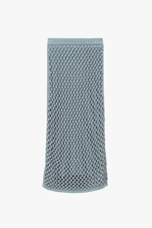 Light blue knitted mesh skirt with crystal embellishments and a matching interior knitted lining. 