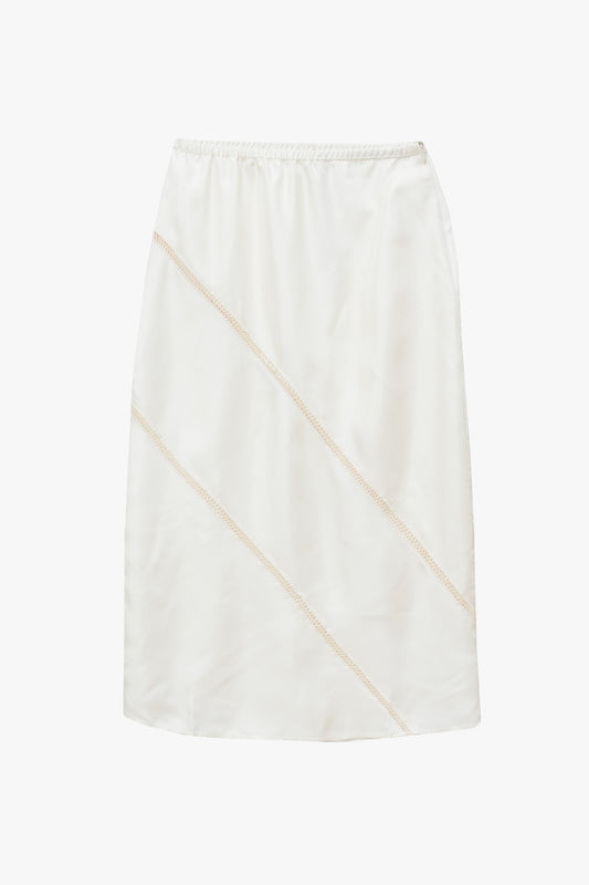 Off white skirt with elastic waist band and zipper at the side seam with diagonal stitching