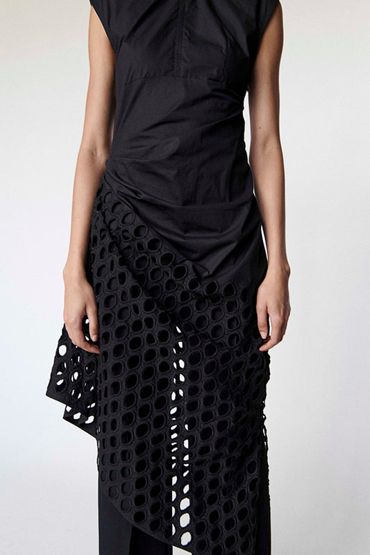 Black dress with a circular cut-out pattern on a white background