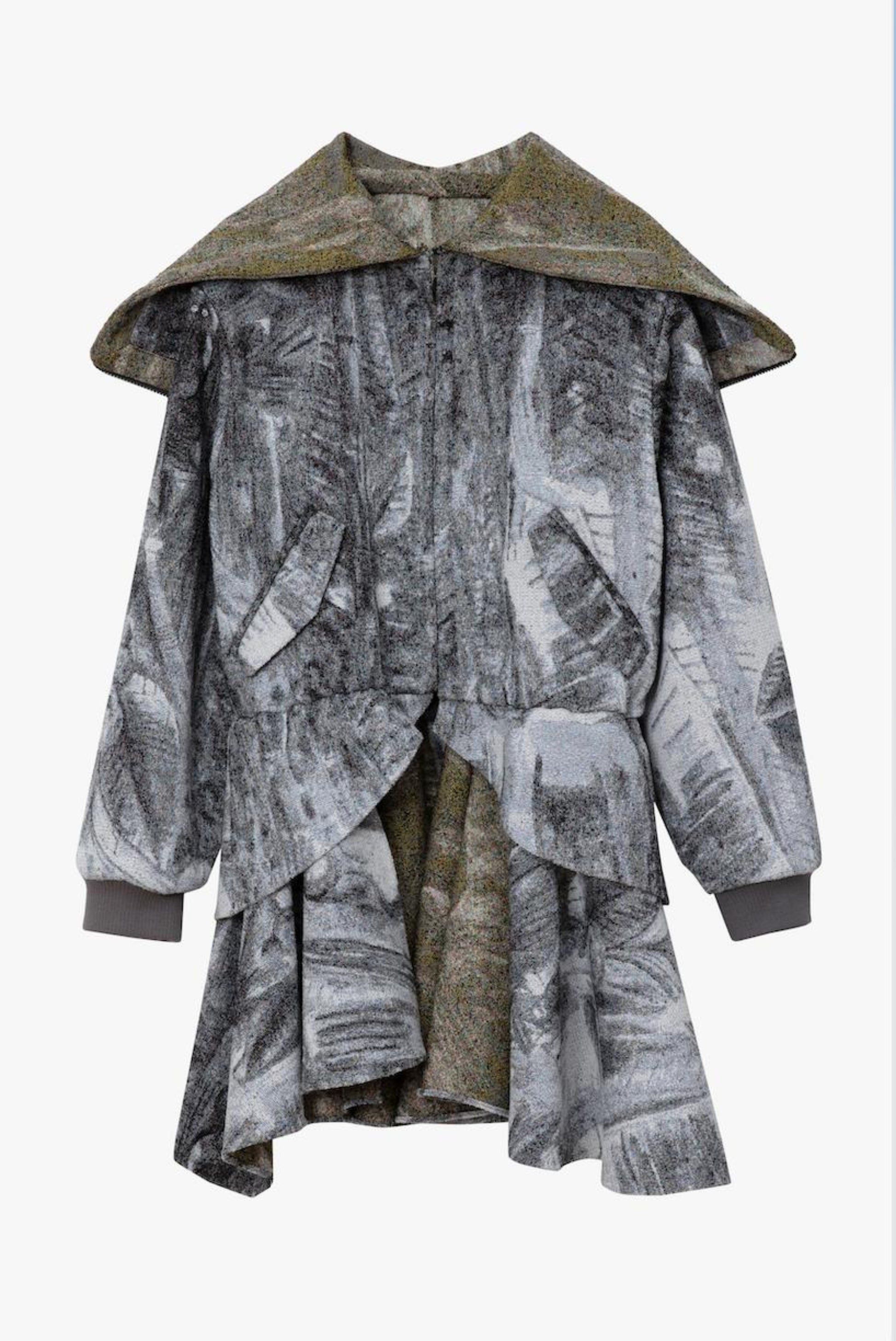 A long-sleeved, asymmetrical draped coat featuring a multi-color print, with a contrasting inner lining and hood. Displayed against a white background.