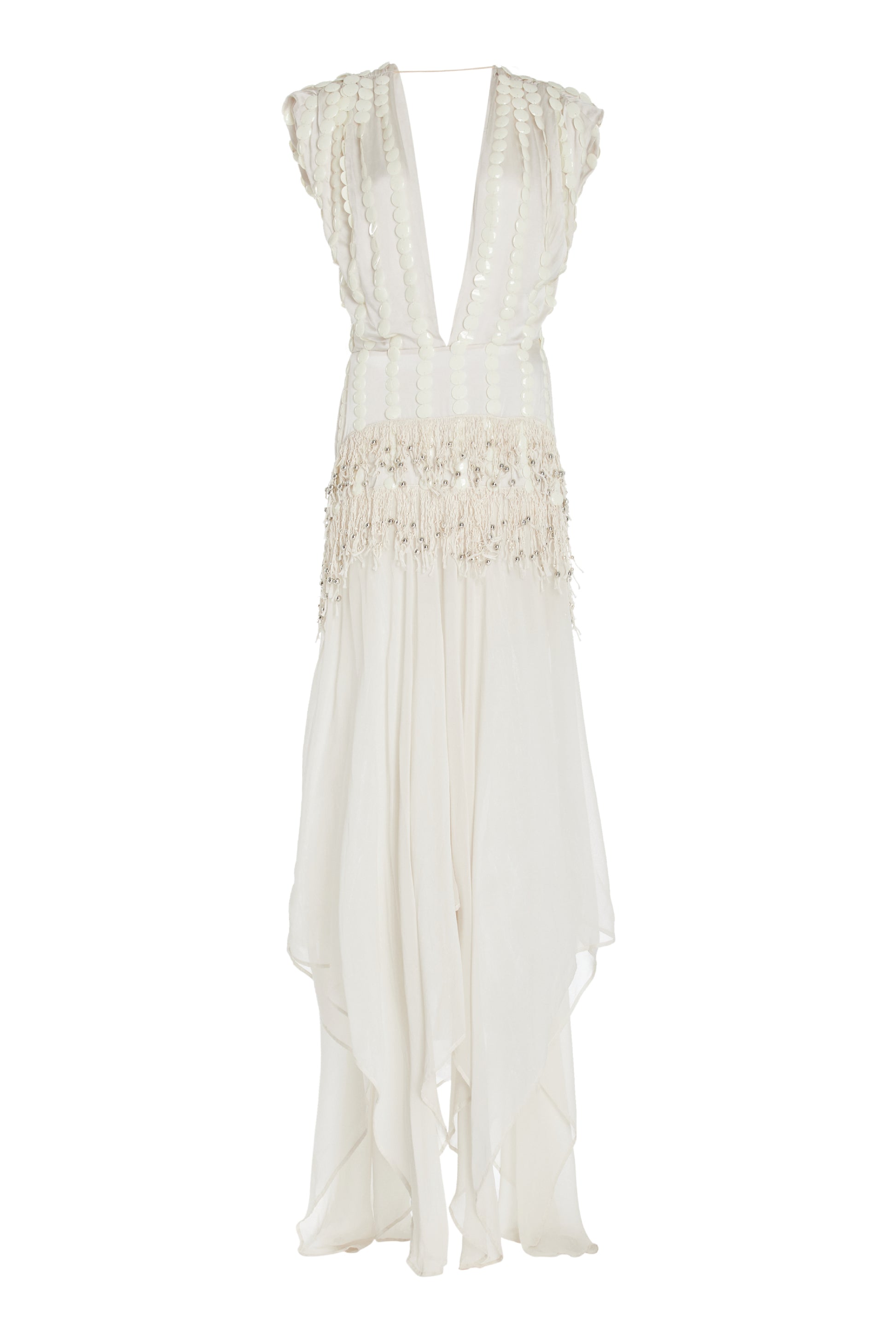 White dress with deep cut out and embellishments going down the side. Fringe detailing in the middle and flowy  skirt photographed against a white background. 